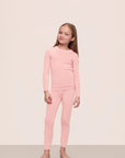 Model is wearing Kids TENCEL™ Modal Unisex Long PJ Set in Silver Pink/Ivory