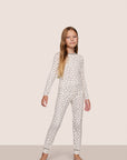 Model is wearing Kids Printed TENCEL™ Modal Unisex Long PJ Set in Heart To Heart Black/Blk