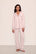 Model is wearing Gisele TENCEL™ Modal Long PJ Set in Sorbet Pink/Black