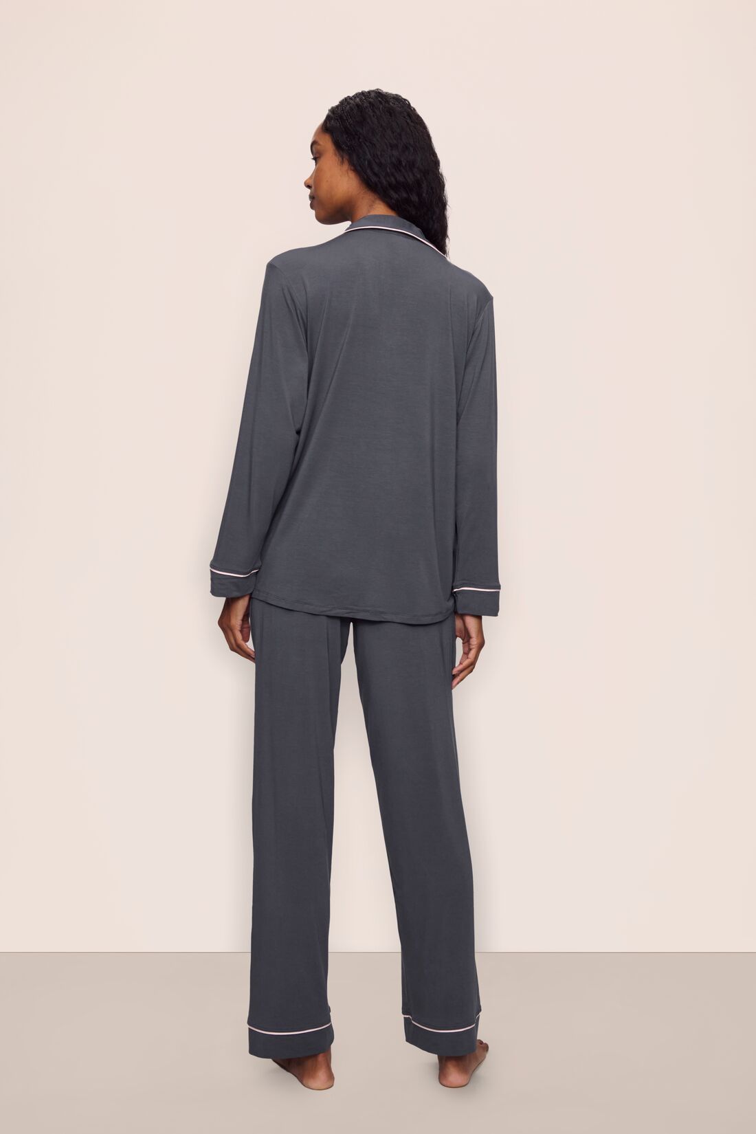 Model is wearing Gisele TENCEL™ Modal Long PJ Set in Graphite/Sorbet Pink