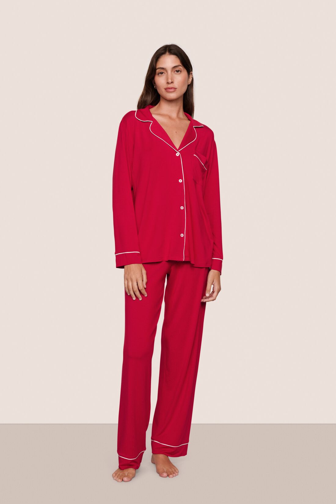 Model is wearing Gisele TENCEL™ Modal Long PJ Set  in Holly Red/Ivory