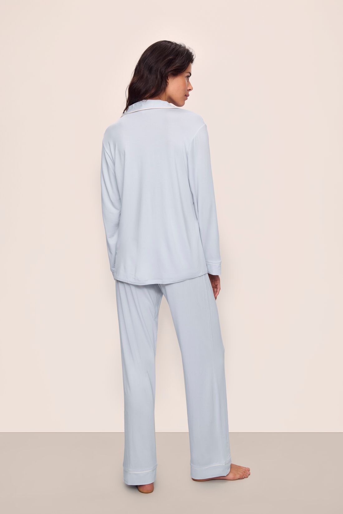 Model is wearing Gisele TENCEL™ Modal Long PJ Set in Ice Blue/Ivory
