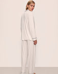 Model wears Gisele TENCEL™ Modal Long PJ Set in Pure Ivory/Navy