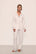 Model wears Gisele TENCEL™ Modal Long PJ Set in Pure Ivory/Navy
