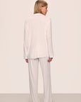 Model is wearing Gisele TENCEL™ Modal Long PJ Set in White/Ice Blue