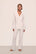 Model is wearing Gisele TENCEL™ Modal Long PJ Set in White/Ice Blue