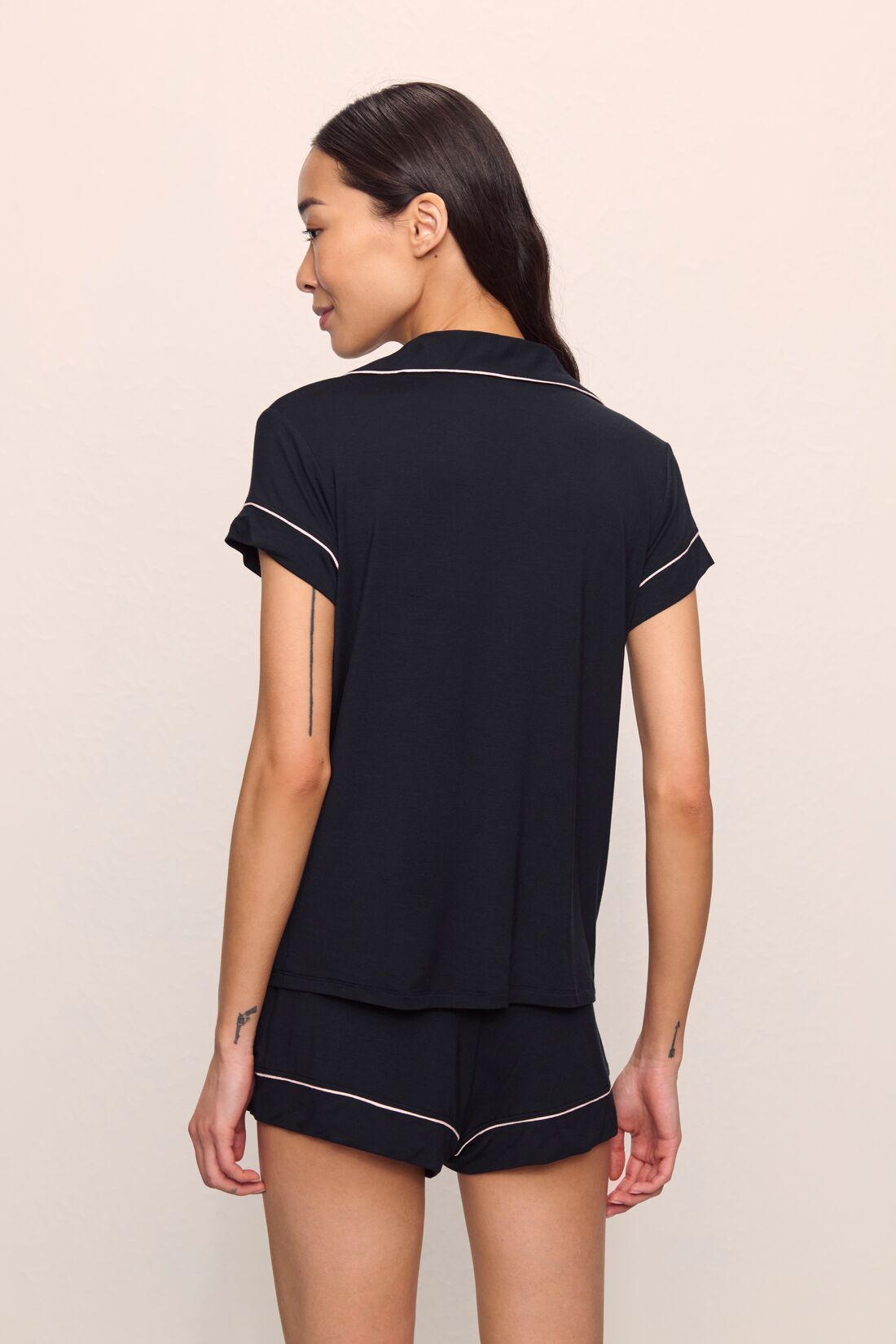 Model is wearing Gisele TENCEL™ Modal Shortie Short PJ Set in Black/Sorbet Pink