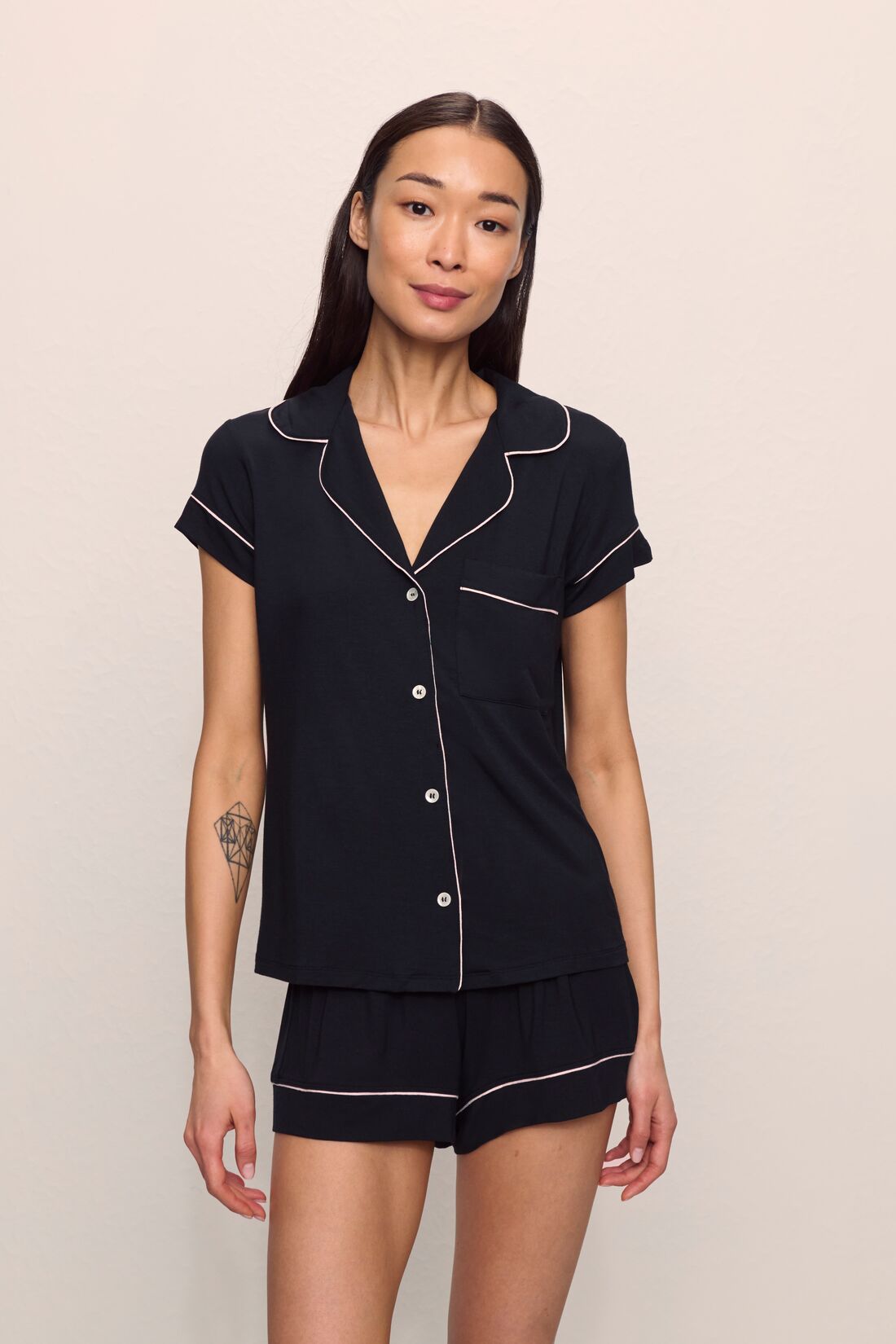Model is wearing Gisele TENCEL™ Modal Shortie Short PJ Set in Black/Sorbet Pink