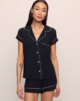 Model is wearing Gisele TENCEL™ Modal Shortie Short PJ Set in Black/Sorbet Pink