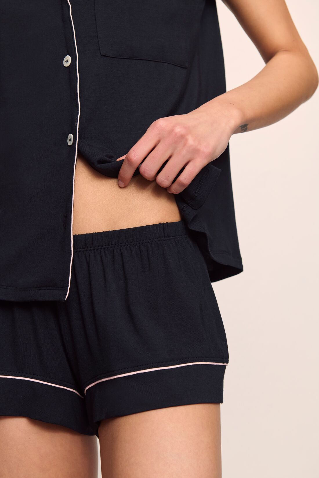 Model is wearing Gisele TENCEL™ Modal Shortie Short PJ Set in Black/Sorbet Pink