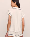 Model is wearing Gisele TENCEL™ Modal Shortie Short PJ Set in Pure Ivory/Navy