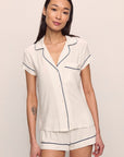 Model is wearing Gisele TENCEL™ Modal Shortie Short PJ Set in Pure Ivory/Navy