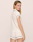 Model is wearing Gisele TENCEL™ Modal Shortie Short PJ Set in Pure Ivory/Navy