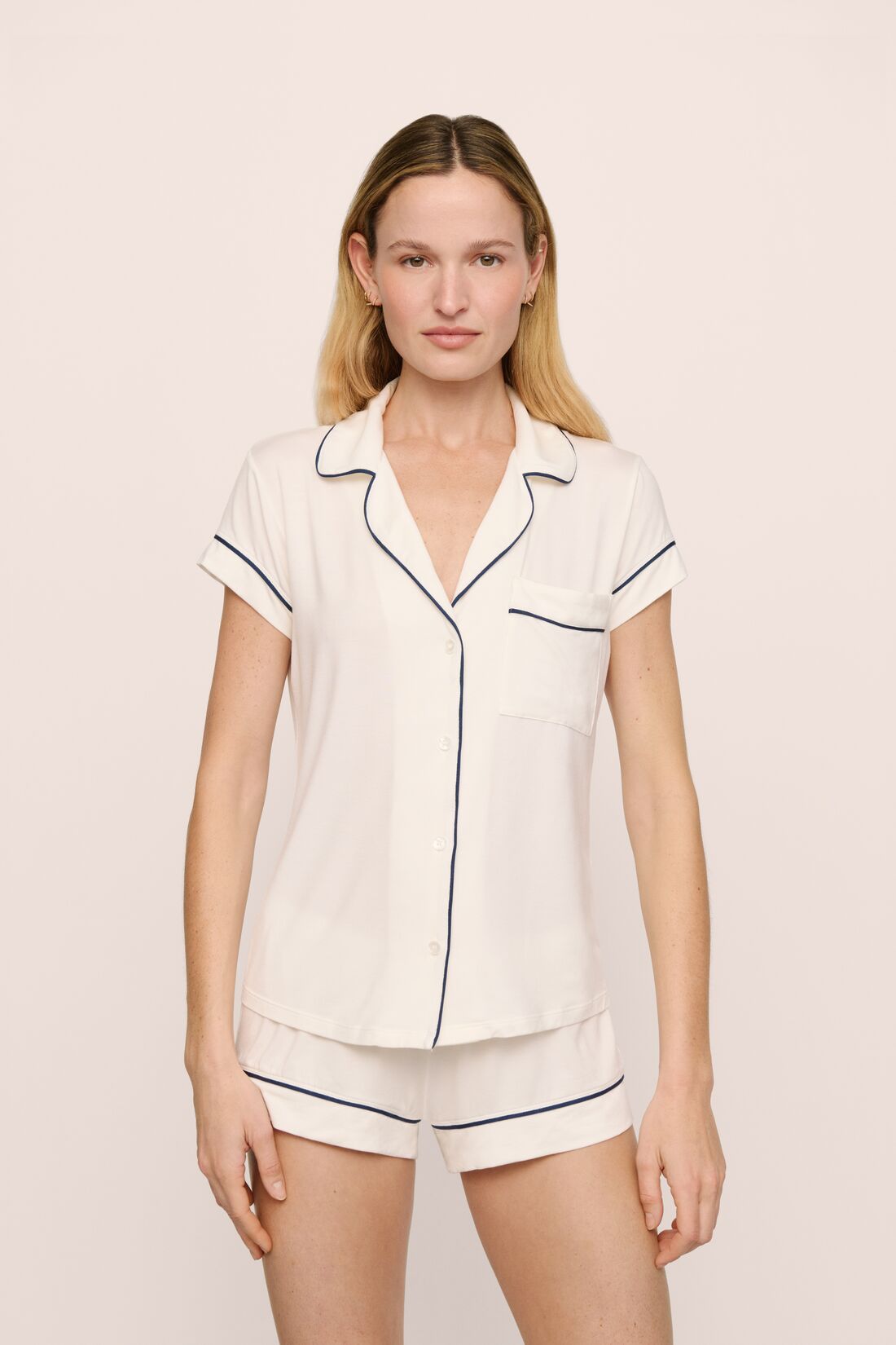 Model is wearing Gisele TENCEL™ Modal Shortie Short PJ Set in Pure Ivory/Navy