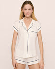 Model is wearing Gisele TENCEL™ Modal Shortie Short PJ Set in Pure Ivory/Navy