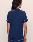 Model is wearing Gisele TENCEL™ Modal Relaxed Short PJ Set in Navy/Ivory