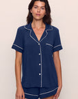 Model is wearing Gisele TENCEL™ Modal Relaxed Short PJ Set in Navy/Ivory