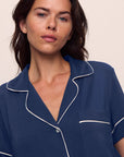 Model is wearing Gisele TENCEL™ Modal Relaxed Short PJ Set in Navy/Ivory