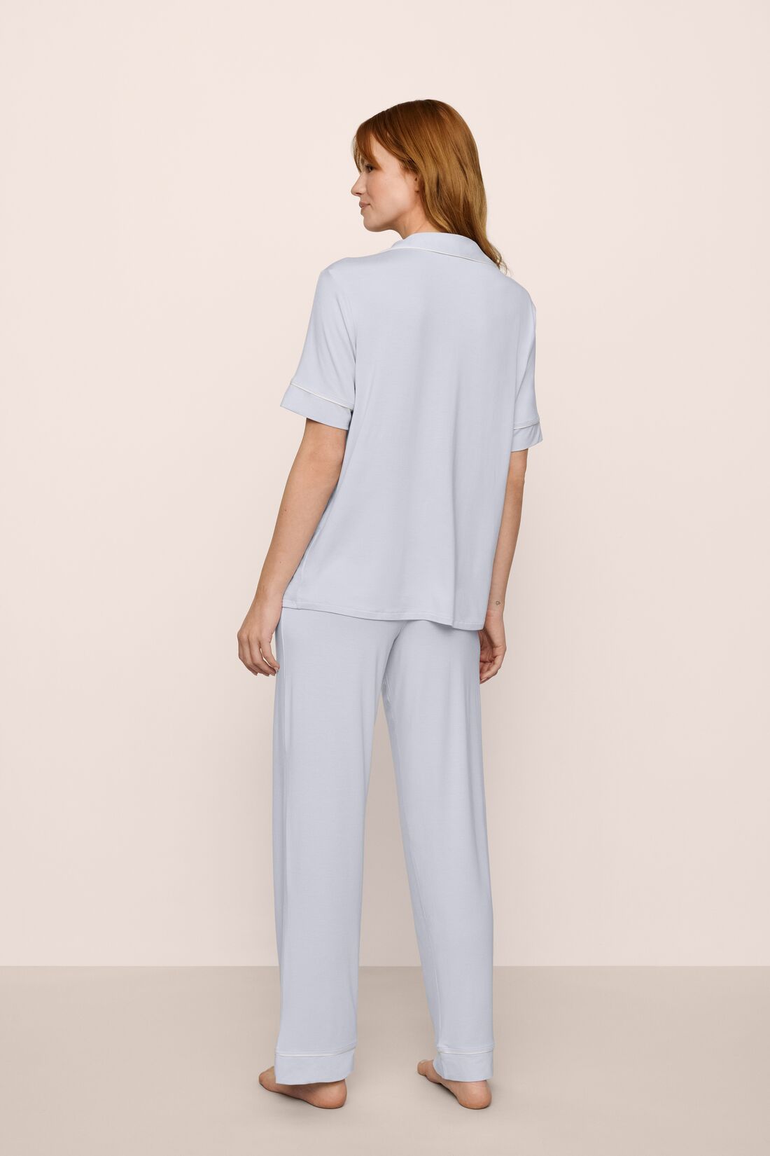 Model is wearing Gisele TENCEL™ Short Sleeve Pant PJ Set in Ice Blue/Ivory
