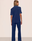 Model is wearing Gisele TENCEL™ Modal Short Sleeve & Pant PJ Set in Navy/Ivory