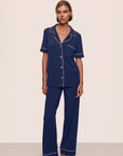 Model is wearing Gisele TENCEL™ Modal Short Sleeve & Pant PJ Set in Navy/Ivory