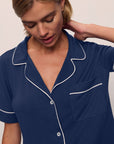 Model is wearing Gisele TENCEL™ Modal Short Sleeve & Pant PJ Set in Navy/Ivory