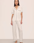 Model is wearing Gisele TENCEL™ Modal Short Sleeve & Pant PJ Set in Pure Ivory/Navy