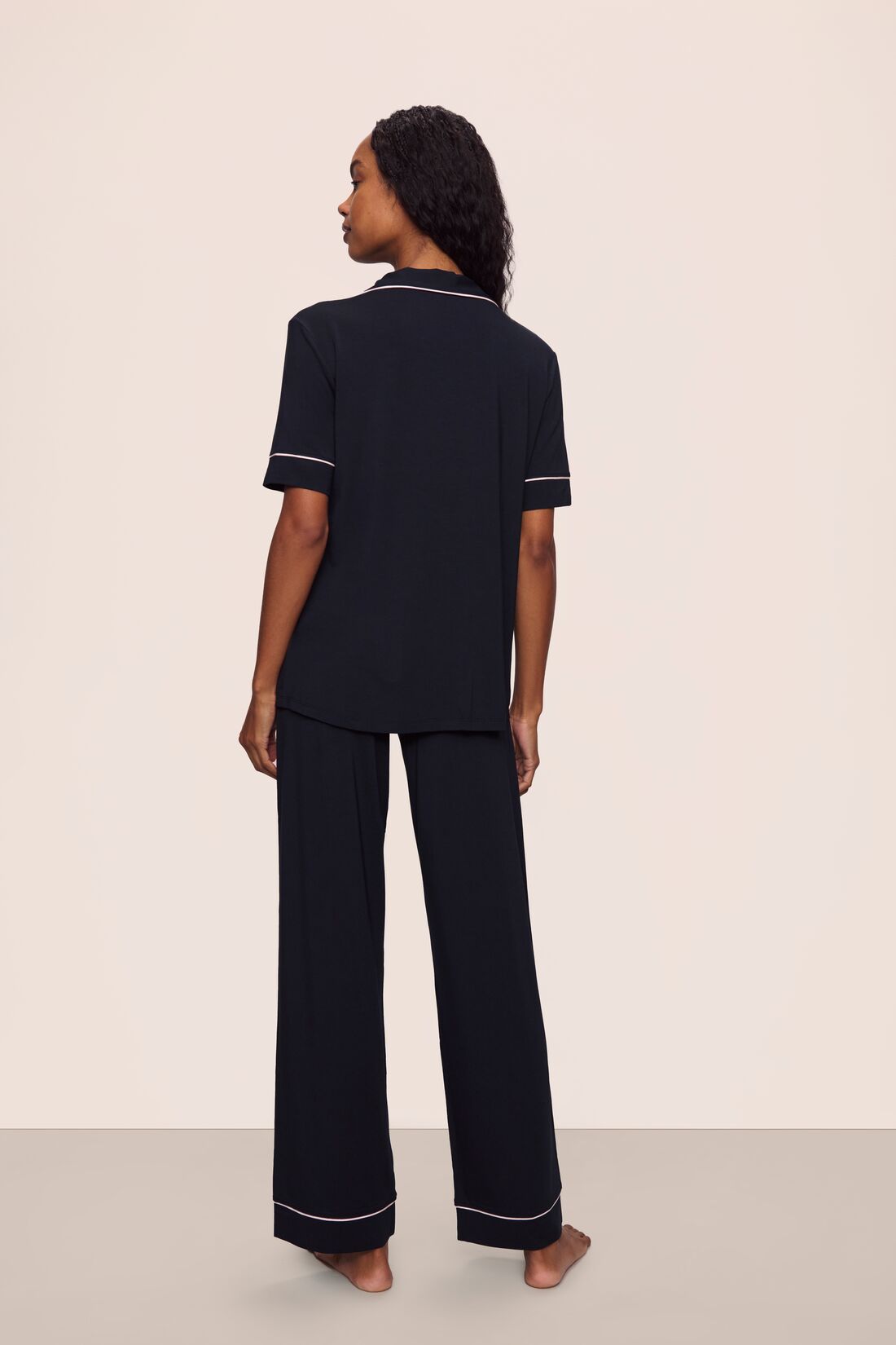 Model is wearing Gisele TENCEL™ Modal Short Sleeve & Pant PJ Set Black/Sorbet Pink