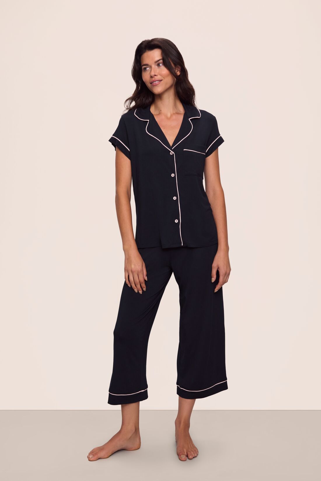 Model is wearing Gisele TENCEL™ Modal Short Sleeve Cropped PJ Set in Black/Sorbet Pink
