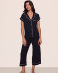 Model is wearing Gisele TENCEL™ Modal Short Sleeve Cropped PJ Set in Black/Sorbet Pink