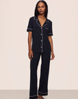 Model is wearing Gisele TENCEL™ Modal Short Sleeve & Pant PJ Set in Black/Sorbet Pink