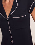 Model is wearing Gisele TENCEL™ Modal Short Sleeve Cropped PJ Set in Black/Sorbet Pink