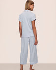 Model is wearing Gisele TENCEL™ Modal Cropped PJ Set in Ice Blue/Ivory
