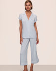 Model is wearing Gisele TENCEL™ Modal Cropped PJ Set in Ice Blue/Ivory