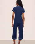 Model is wearing Gisele TENCEL™ Modal Short Sleeve Cropped PJ Set in Navy/Ivory
