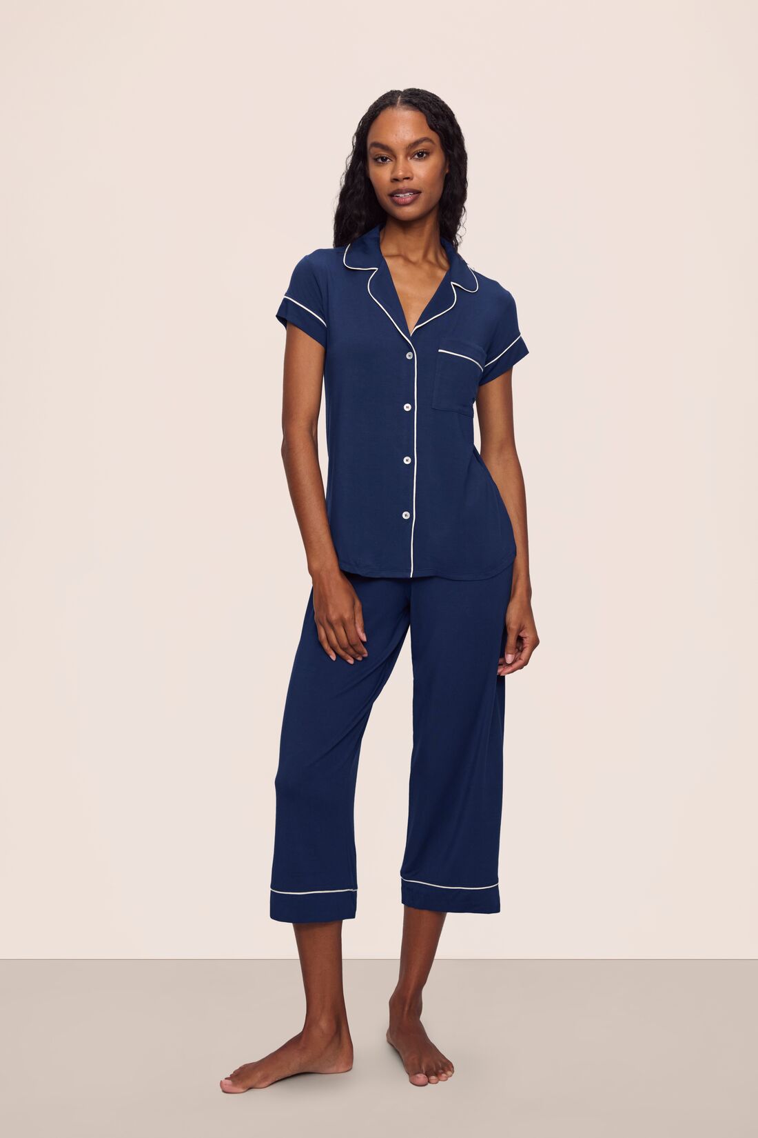 Model is wearing Gisele TENCEL™ Modal Short Sleeve Cropped PJ Set in Navy/Ivory