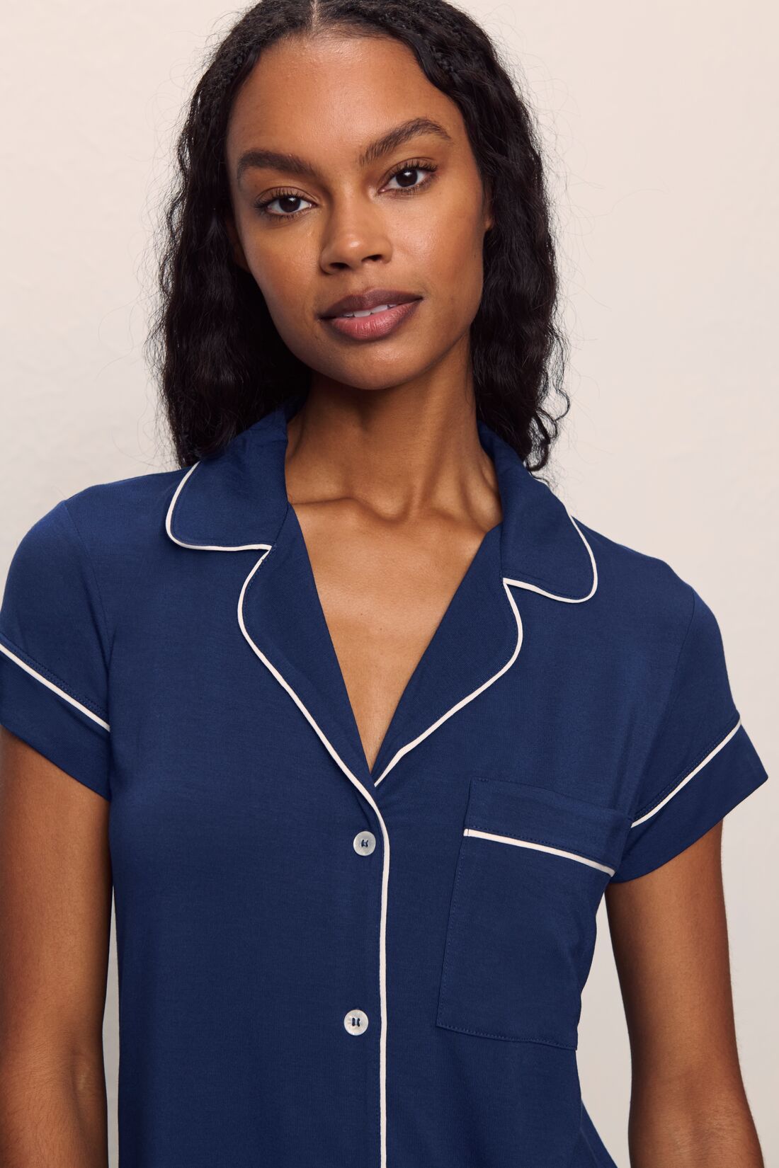 Model is wearing Gisele TENCEL™ Modal Short Sleeve Cropped PJ Set in Navy/Ivory