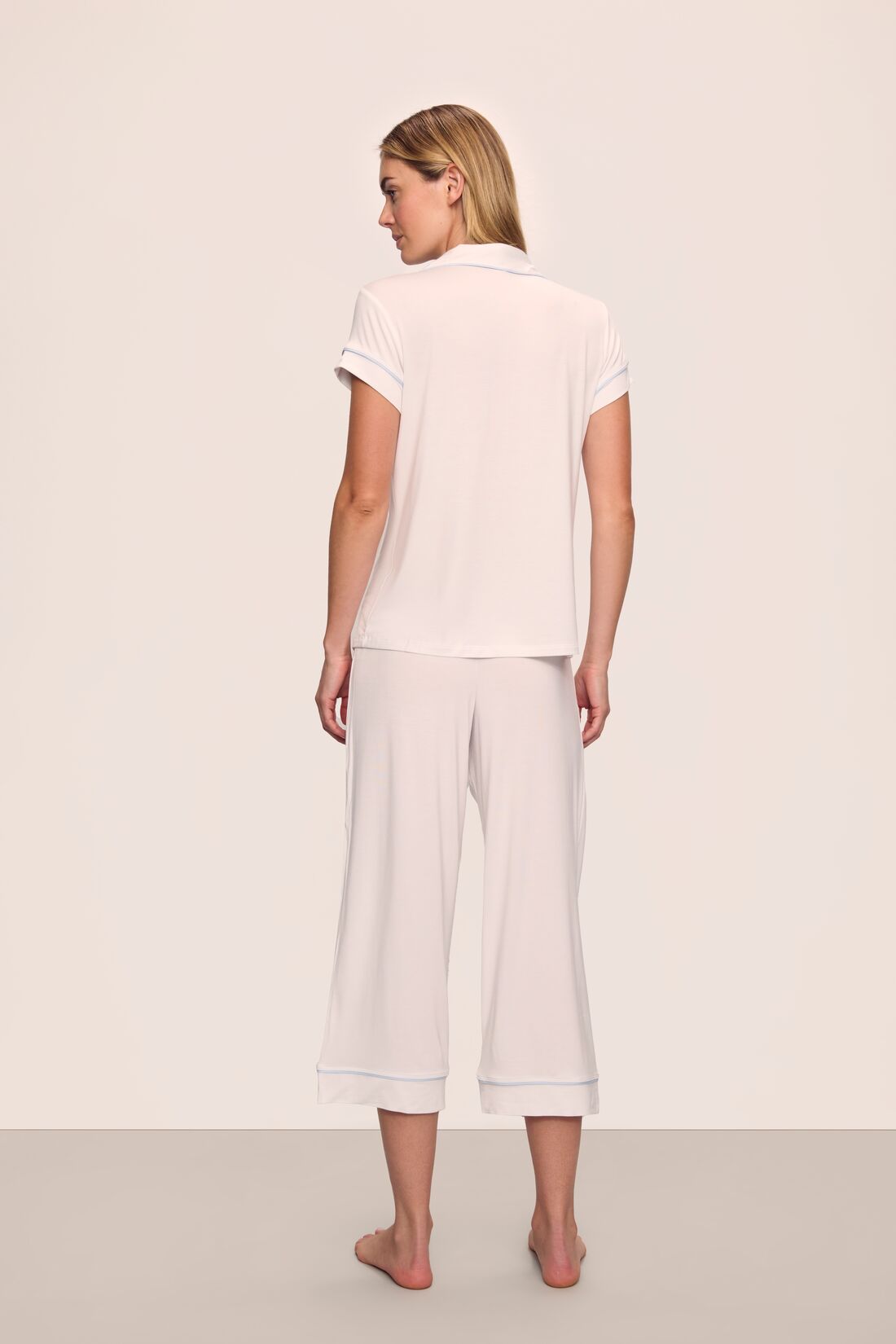 Model is wearing Gisele TENCEL™ Modal Short Sleeve Cropped PJ Set in White/Ice Blue
