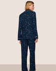 Model is wearing Gisele Printed TENCEL™ Modal Long PJ Set in Forest Pine Navy/Ivory