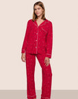 Model is wearing Gisele TENCEL™ Printed Modal Long PJ Set in Nutcracker Holly Red/Ivory