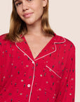 Model is wearing Gisele Printed TENCEL™ Modal Long PJ Set in Nutcracker Holly Red/Ivory