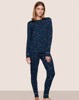 Model is wearing Gisele Printed TENCEL™ Modal Crewneck PJ Set in Forest Pine Navy/Ivory