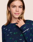 Model is wearing Gisele Printed TENCEL™ Modal Crewneck PJ Set in Forest Pine Navy/Ivory
