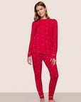 Model is wearing Gisele TENCEL™ Crewneck PJ Set in Nutcracker Holly Red/Ivory