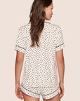 Model is wearing Gisele Printed TENCEL™ Modal Relaxed Short PJ Set in Heart To Heart Black/Blk