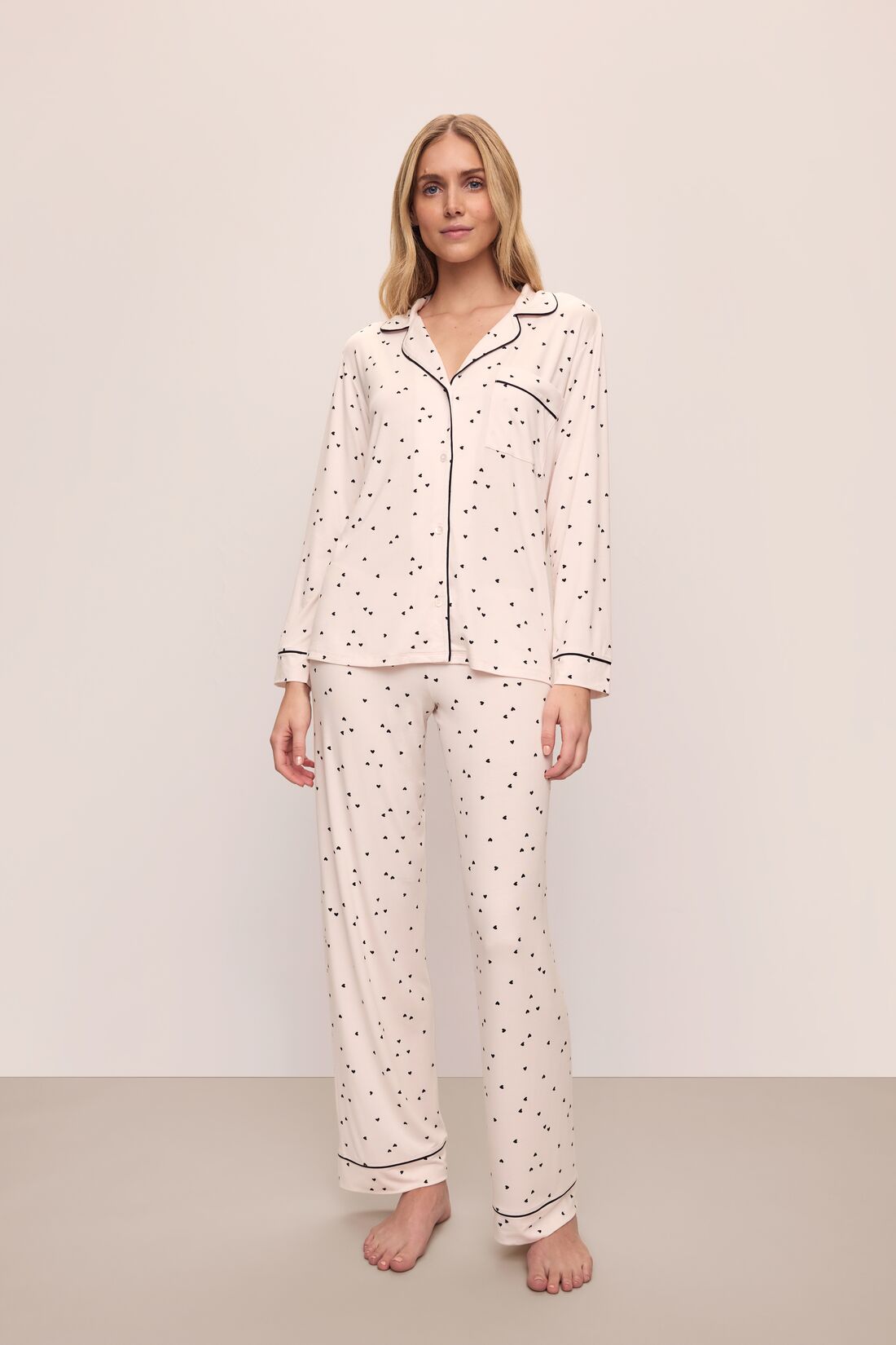 Model is wearing Gisele Printed TENCEL™ Modal Long PJ Set in Little Heart Sorbet Pink/Black