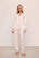 Model is wearing Gisele Printed TENCEL™ Modal Long PJ Set in Little Heart Sorbet Pink/Black