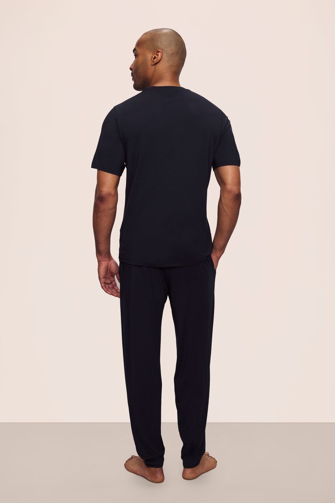 Model is wearing Henry TENCEL™ Modal Short Sleeve & Pant PJ Set in Black