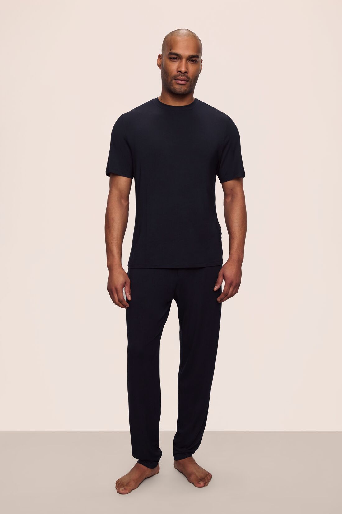 Model is wearing Henry TENCEL™ Modal Short Sleeve & Pant PJ Set in Black