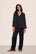 Model is wearing Inez Washable Silk Long PJ Set in Black/Champagne